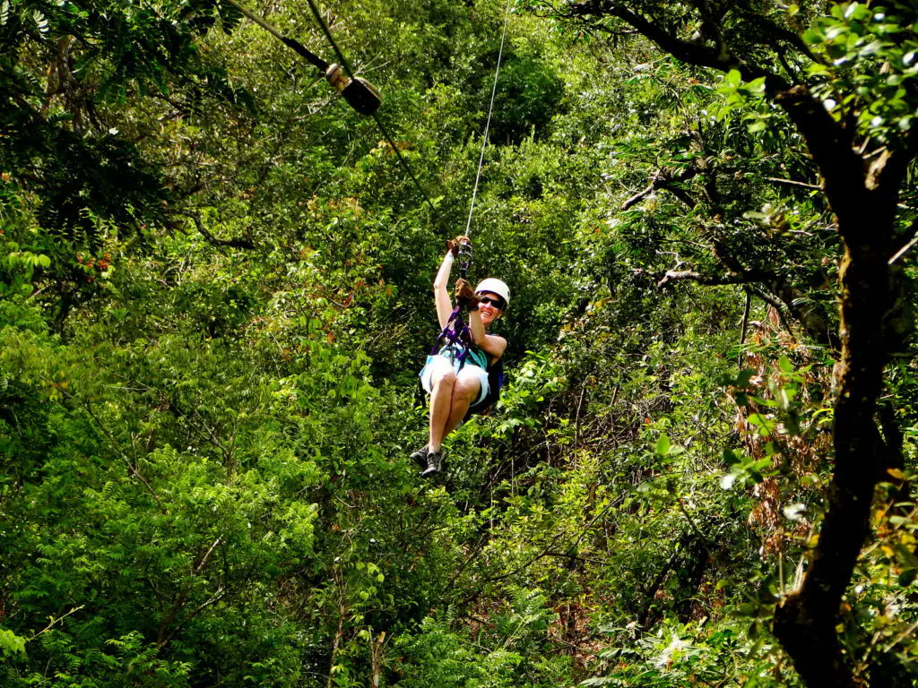 Zip lining through the Costa Rican rainforest canopy, one of the most thrilling adventure activities in Central America 