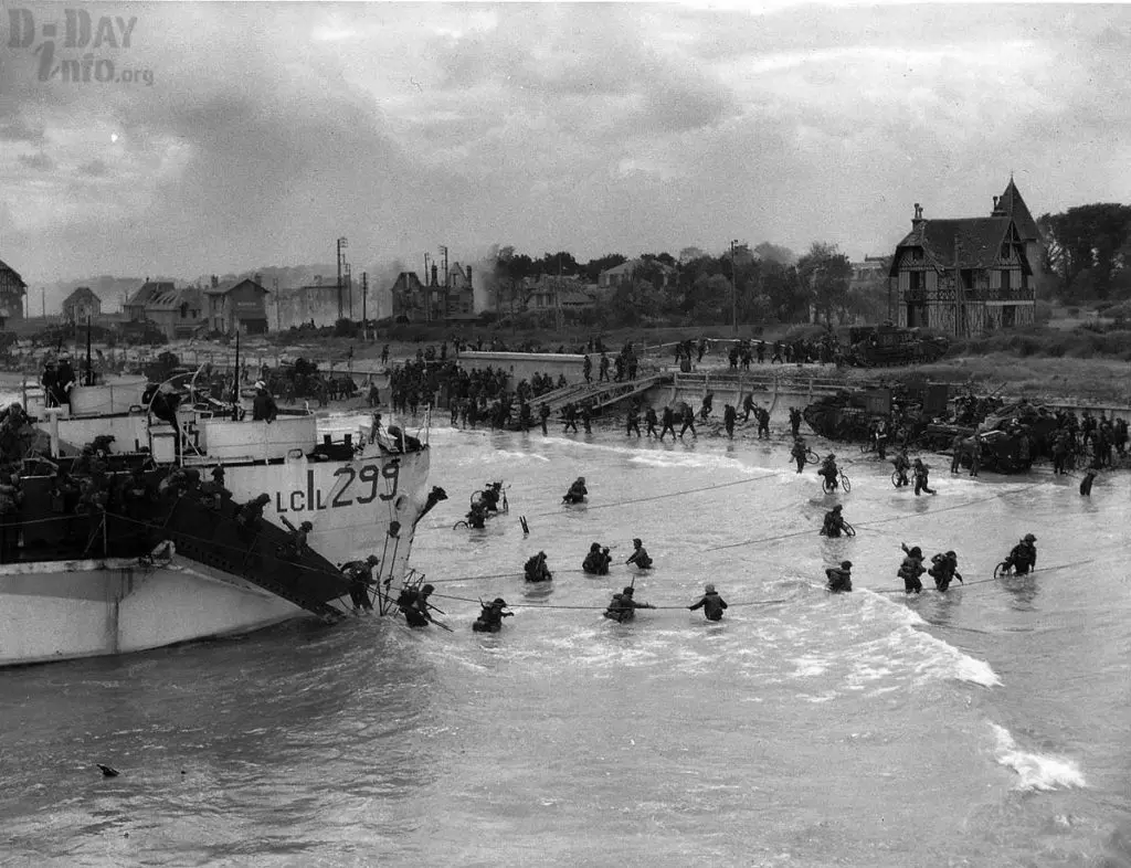 Allied troops wade ashore from landing craft LCI 299 during the D-Day invasion of Normandy on June 6, 1944