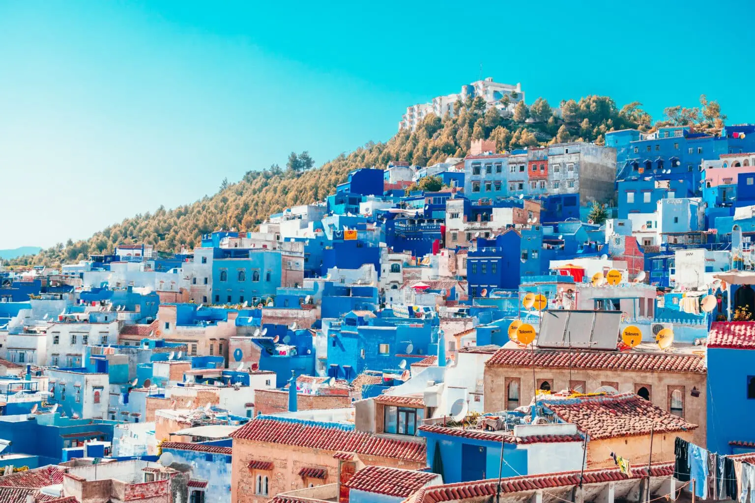 The Blue Pearl of Morocco, where Chefchaouen's iconic medina clings to the Rif Mountain hillside