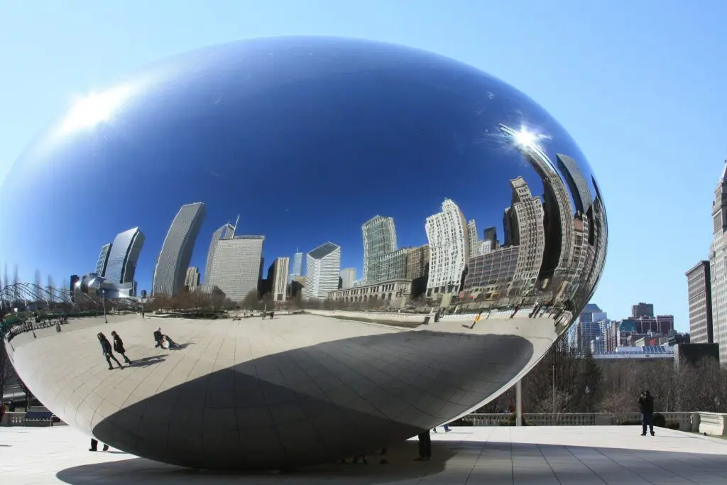 Cloud Gate in Millennium Park reflects the Chicago skyline in its mirrored steel surface, a beloved landmark and one of the world's most interactive public sculptures