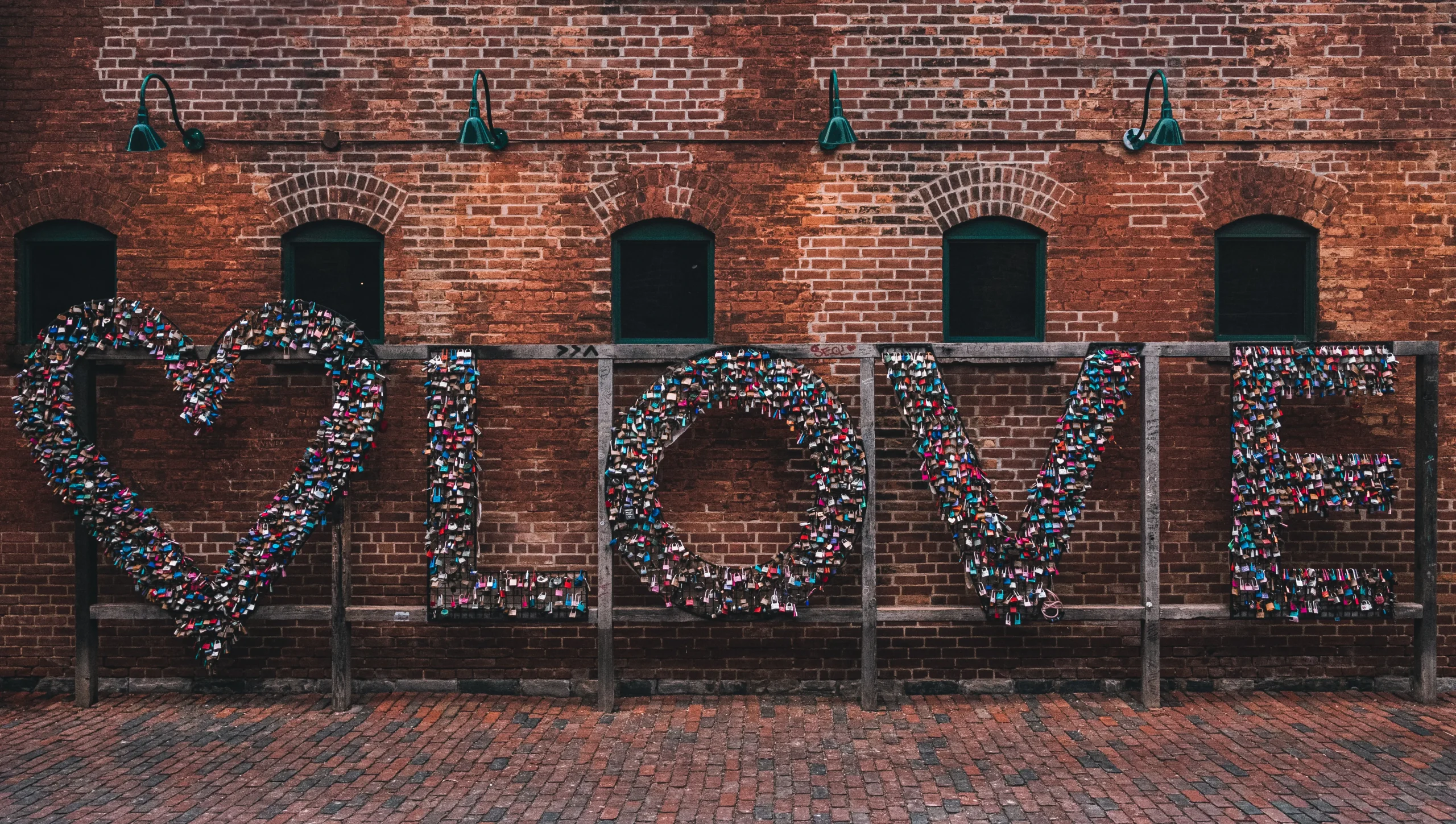 Thousands of love locks form the word LOVE on a wooden frame in Toronto's Distillery District, a creative landmark in one of Canada's most vibrant arts neighborhoods