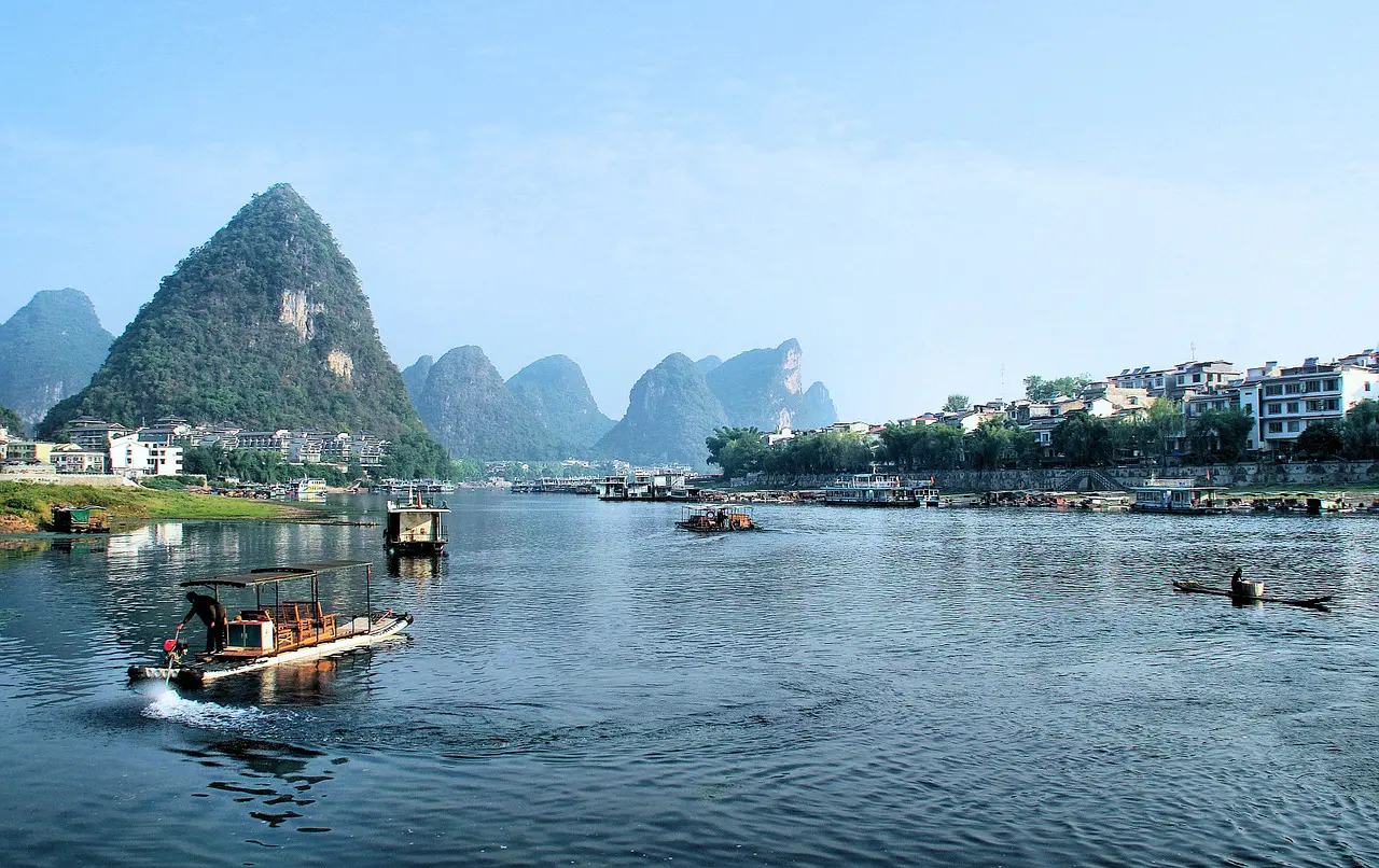 Boats drift along the Li River in Guilin, framed by the iconic karst peaks that define southern China's landscape