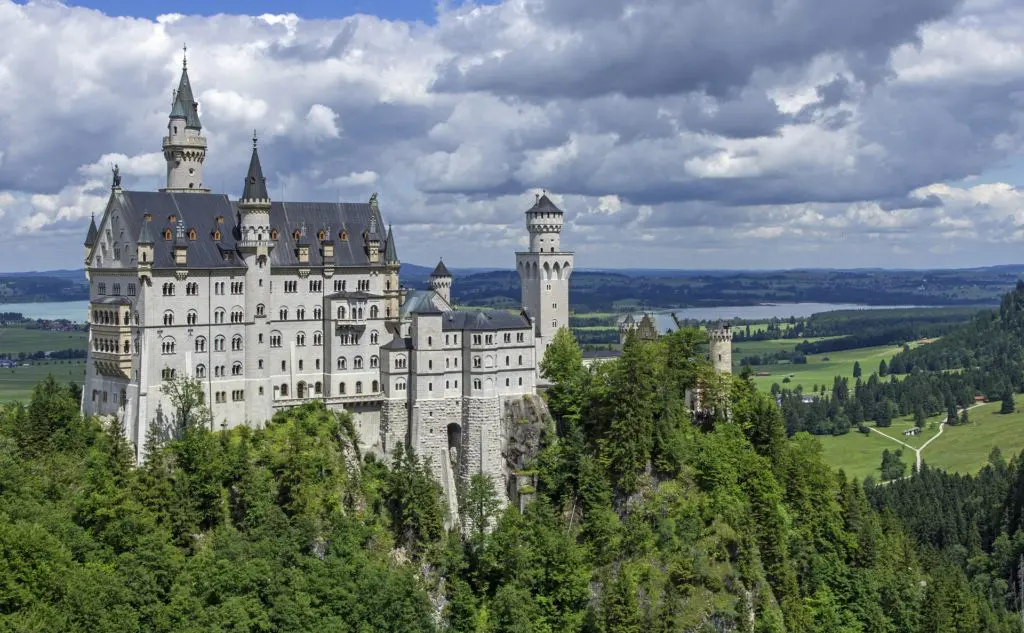 The fairy-tale towers of Neuschwanstein Castle rise above the Bavarian countryside, one of the most visited and photographed castles in the world