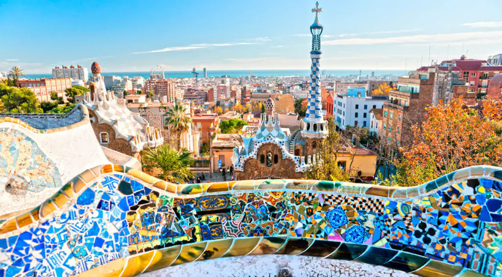 A close-up of the trencadis mosaic at Park Guell reveals the intricate hand-laid ceramic tile work that defines Gaudi's distinctive decorative style