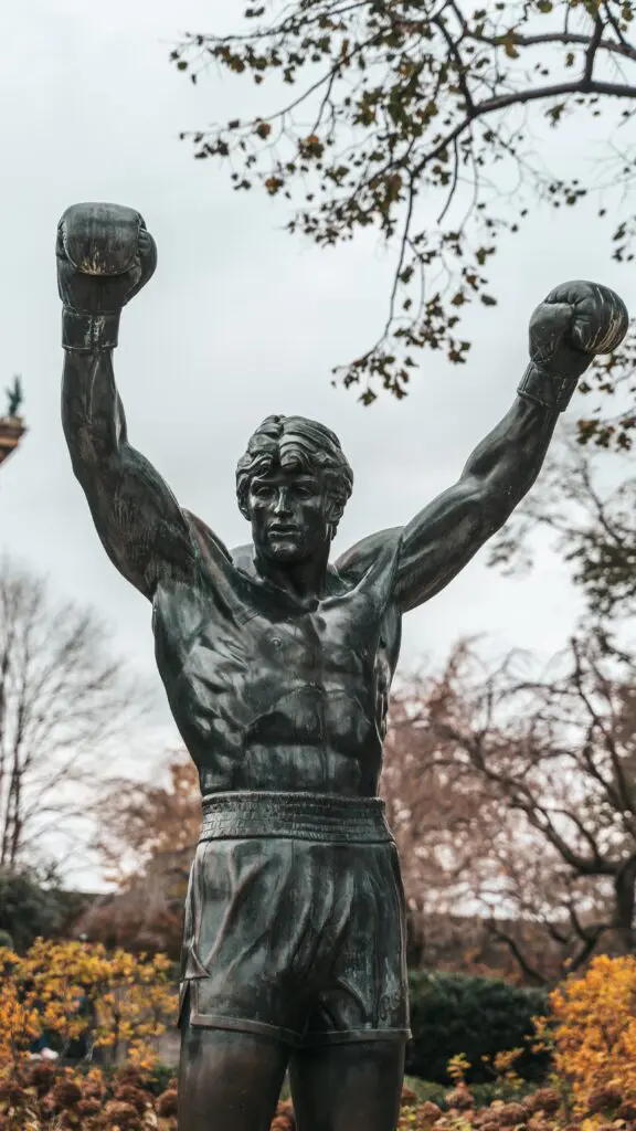 The Rocky statue stands with arms raised at the base of the Philadelphia Museum of Art steps, a beloved pop culture landmark in the heart of Philadelphia