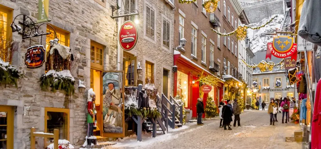 Rue du Petit Champlain in Old Quebec City is one of North America's oldest commercial streets, its narrow lane of colorful shops charming visitors year-round