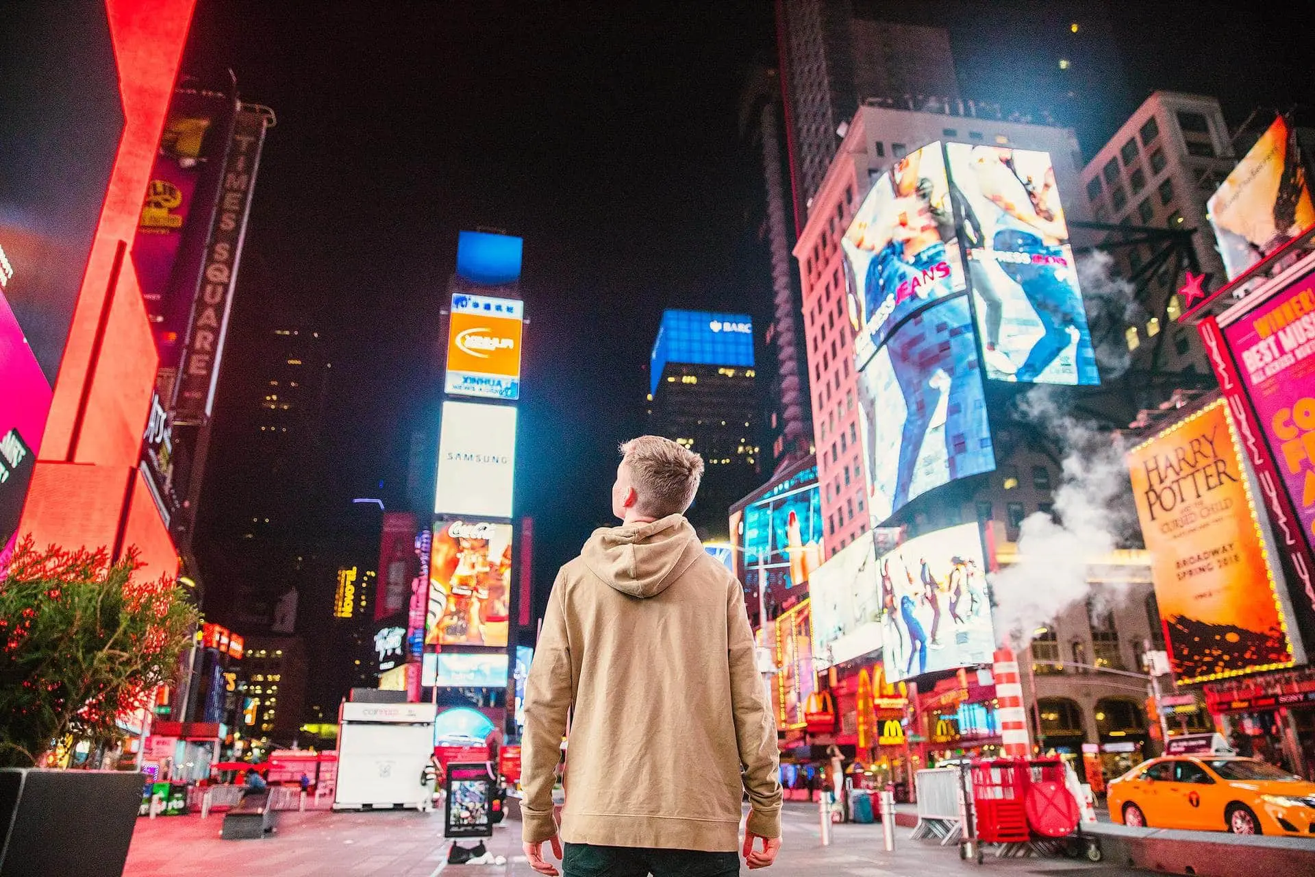 Times Square blazes with neon, LED screens, and the constant movement of thousands of visitors in the city that never sleeps